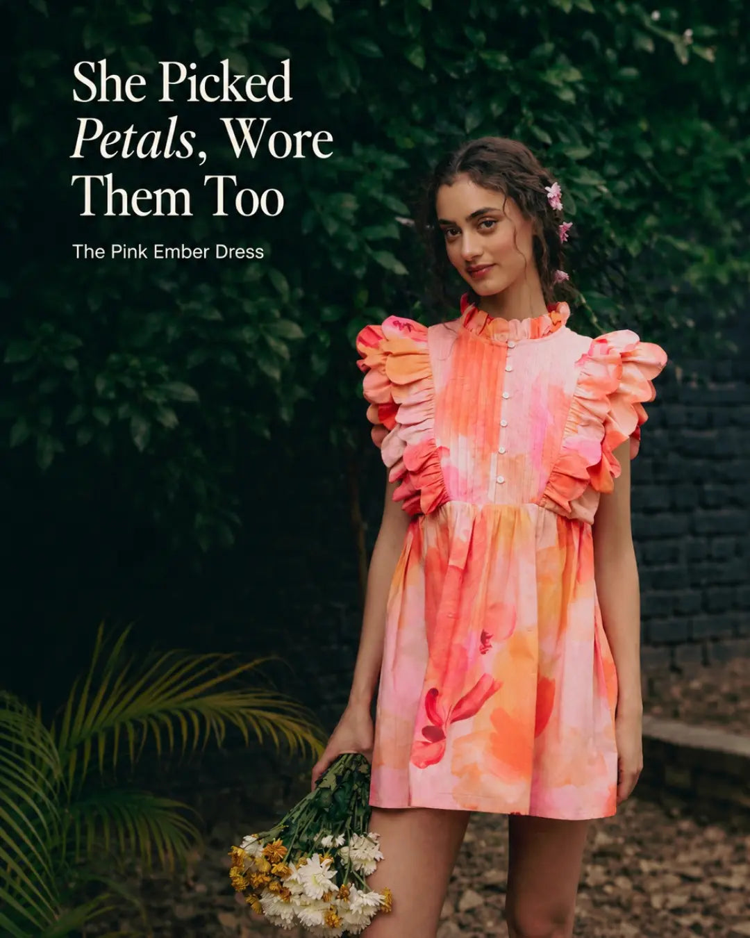 Model in striped bow co-ord, garden setting. Tied With Intention.